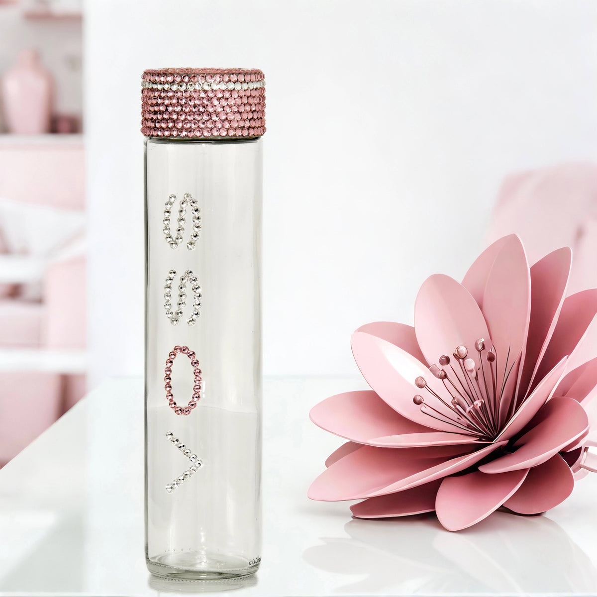 Voss glass water bottle with clear and pink crystals in pink floral glam setting