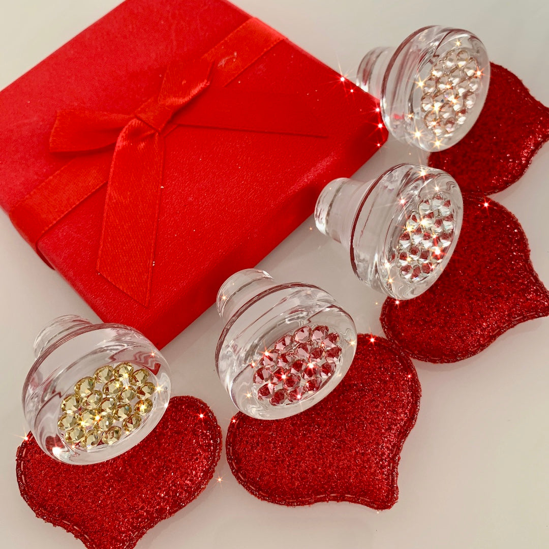 Bottle stoppers with gold, pink, clear, rose gold crystals in red hearts gifting setting