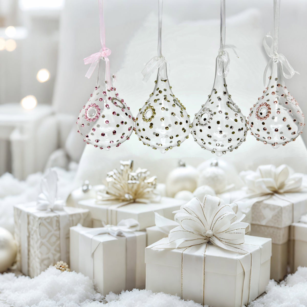 Christmas drop ornaments with clear, gold, pink, rose gold crystals in white gifting setting