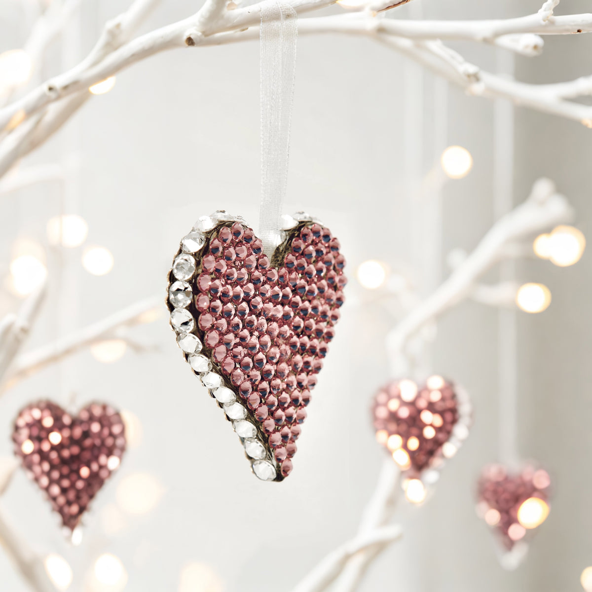 Pink side of Heart ornament with pink and clear crystals in glam setting
